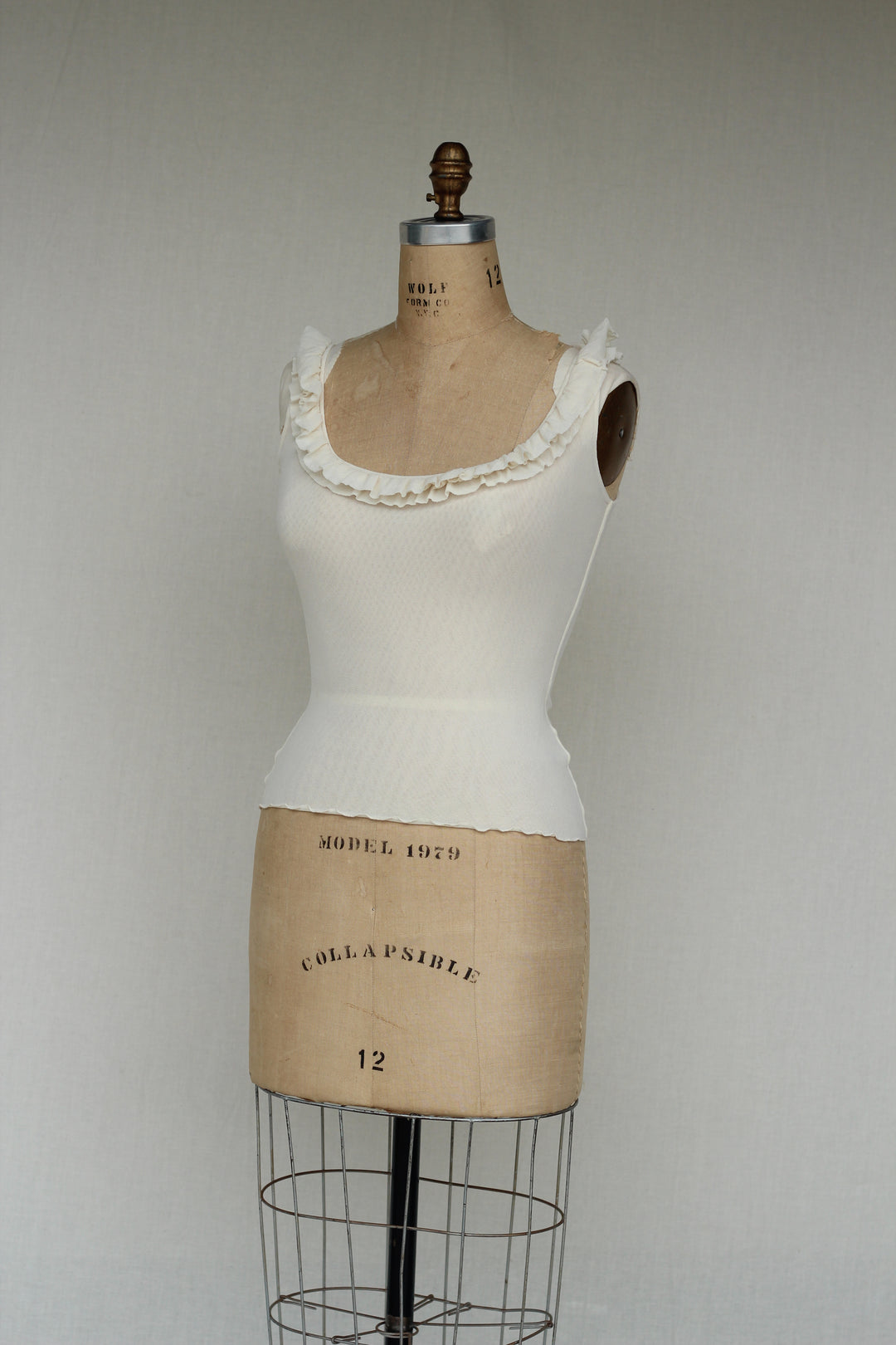 Sweat Pea Ivory Ruffle Ivory Sleeveless Top