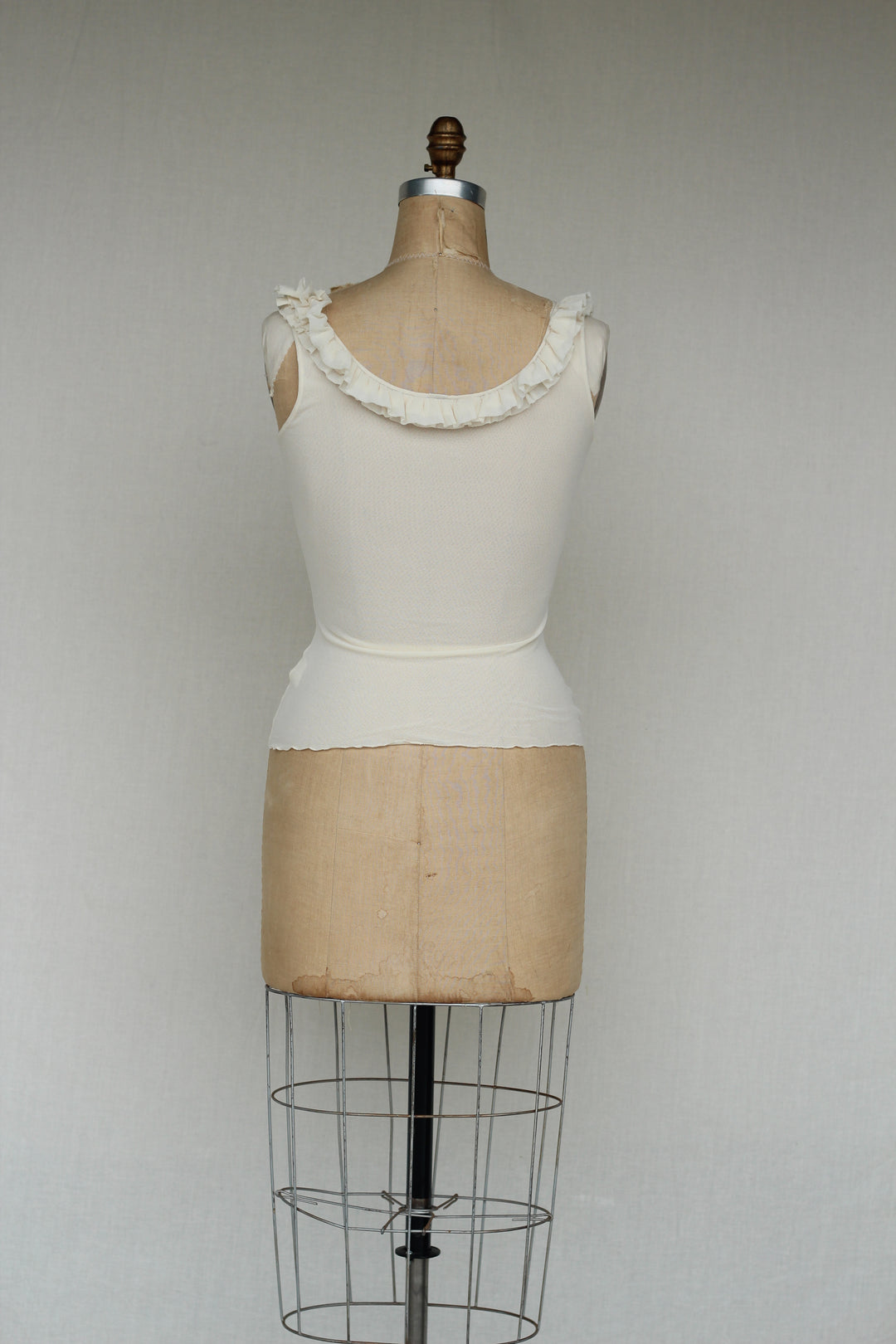 Sweat Pea Ivory Ruffle Ivory Sleeveless Top